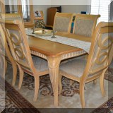 F24. American Drew dining table with 2 additional leaves and 8 chairs. Table: 29”h x 75”w x 43”d 